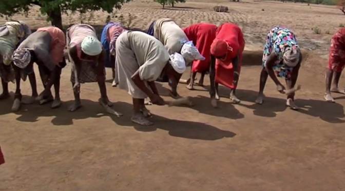 Women working in Kpare on rooftop